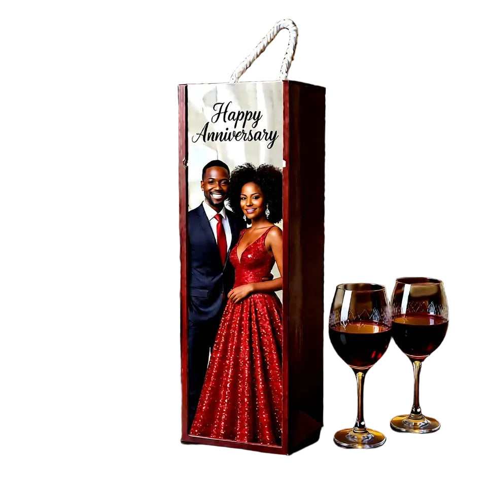 Wine bottle box with a couple's photo and 'Happy Anniversary' text, placed on a table with two glasses of red wine.